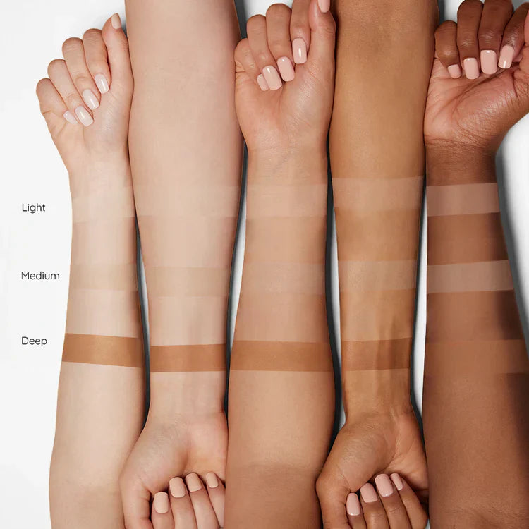 Adaptive color changing cream stick foundation swatches on light, medium, and deep skin tones for a perfect match.
